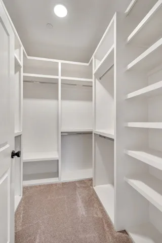 a spacious bathroom with a granite countertop sink mirror and double