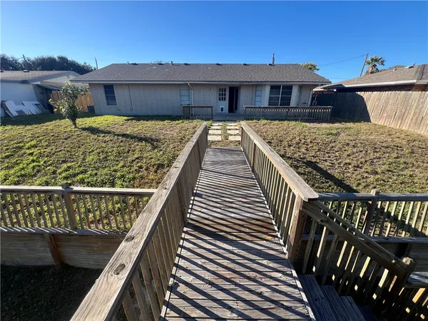 a view of swimming pool with outdoor seating and plants