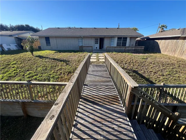 a view of swimming pool with outdoor seating and plants