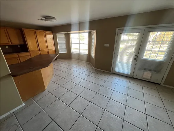a view of an empty room and window