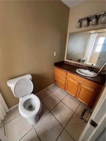 a bathroom with a toilet and a mirror