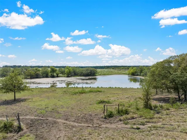 a view of a lake with a big yard