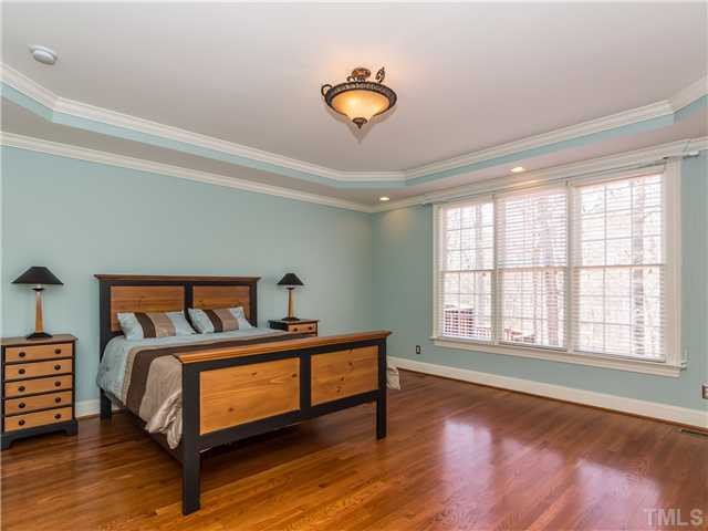 8677 Barrett Ridge Road Wake Forest, NC 27587 - Photo 12 of 25 The spacious master bedroom is located on the first floor and is quite impressive. It has hardwood floors, trey ceiling, crown molding and gets lots of natural light. Master Bedroom