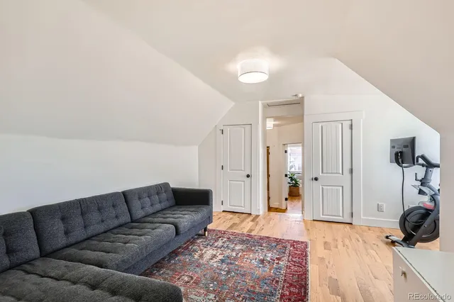 a living room with furniture and a rug