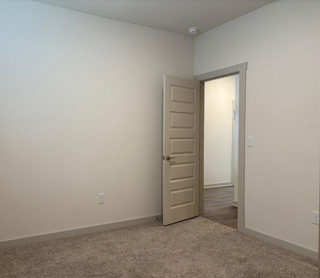 10925 Defender Trail Austin, TX 78754 - Photo 4 of 7 A spacious room offers ample personalizing possibilities, with plush carpeting throughout.