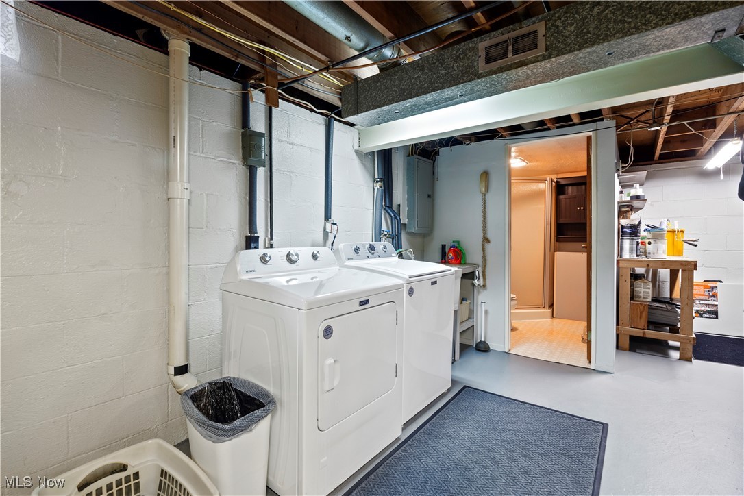20114 Drake Road Strongsville, OH 44149 - Photo 29 of 35 Washroom with electric panel, separate washer and dryer, and concrete floors