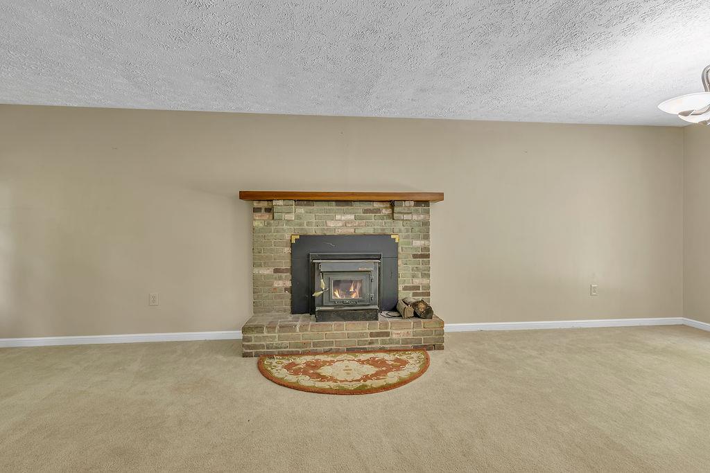 171 Dehaven Road Beaver Falls, PA 15010 - Photo 7 of 35 a room with a fireplace