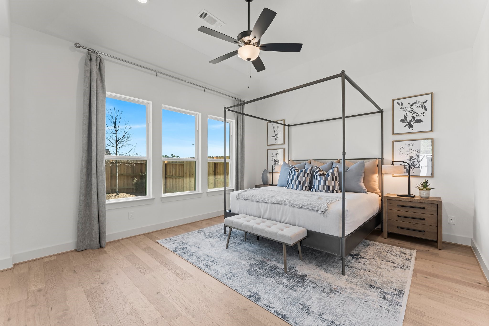 322 Marsh Wren Way Magnolia, TX 77354 - Photo 11 of 19 a spacious bedroom with a bed and a large window