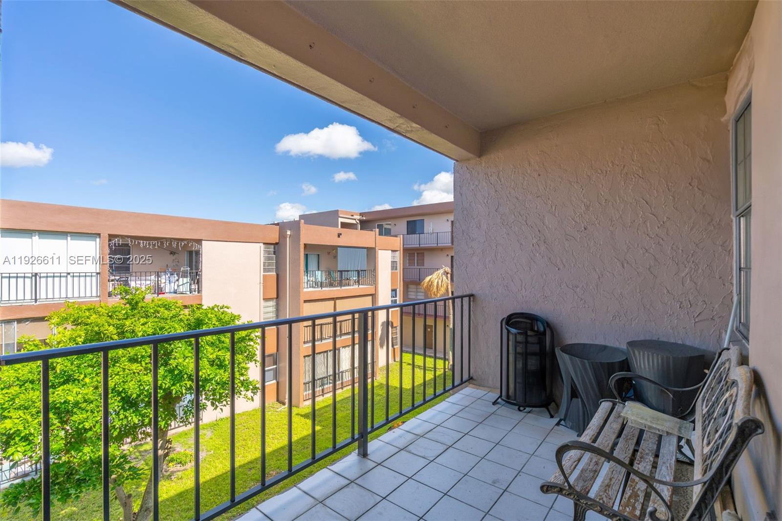 1900 West 68th Street, Unit F302 Hialeah, FL 33014 - Photo 20 of 34 a view of a porch with furniture