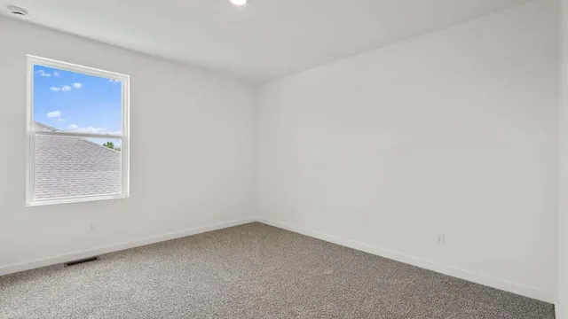 a bathroom with a sink toilet vanity and shower