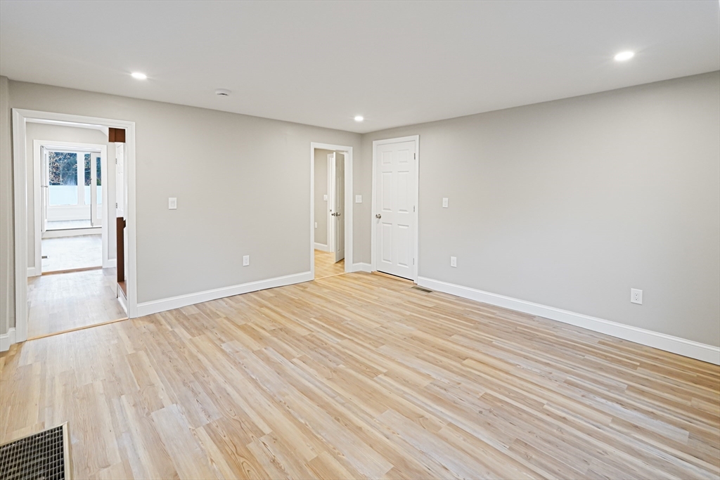 98 Southville Road, Unit B Southborough, MA 01772 - Photo 11 of 32 a view of empty room with wooden floor