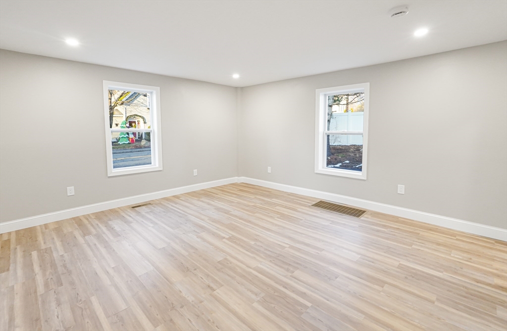 98 Southville Road, Unit B Southborough, MA 01772 - Photo 12 of 32 wooden floor in an empty room with a window