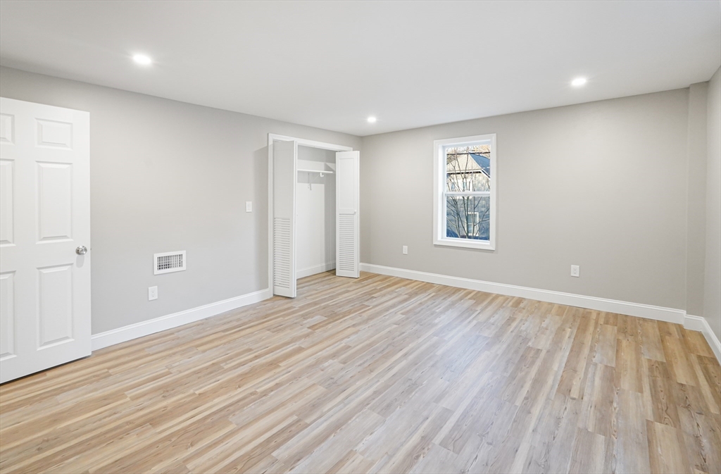 98 Southville Road, Unit B Southborough, MA 01772 - Photo 18 of 32 wooden floor in an empty room with a window