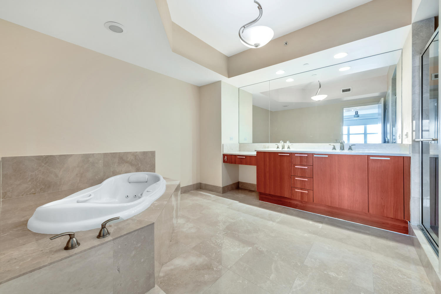 2640 Lake Shore Drive, Unit 1011 Riviera Beach, FL 33404 - Photo 15 of 60 a bathroom with a sink a toilet and mirror