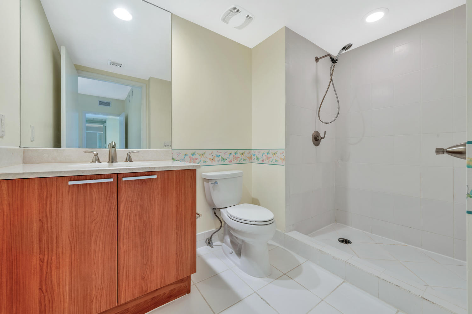 2640 Lake Shore Drive, Unit 1011 Riviera Beach, FL 33404 - Photo 18 of 60 a bathroom with a granite countertop sink toilet and shower