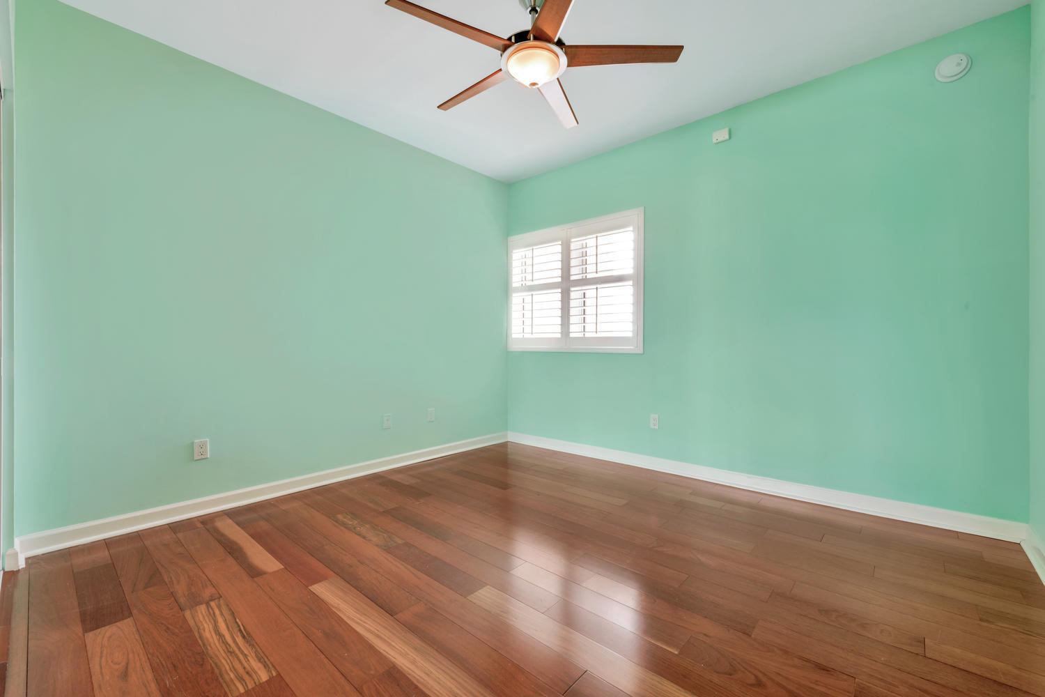 2640 Lake Shore Drive, Unit 1011 Riviera Beach, FL 33404 - Photo 19 of 60 an empty room with a window and ceiling fan