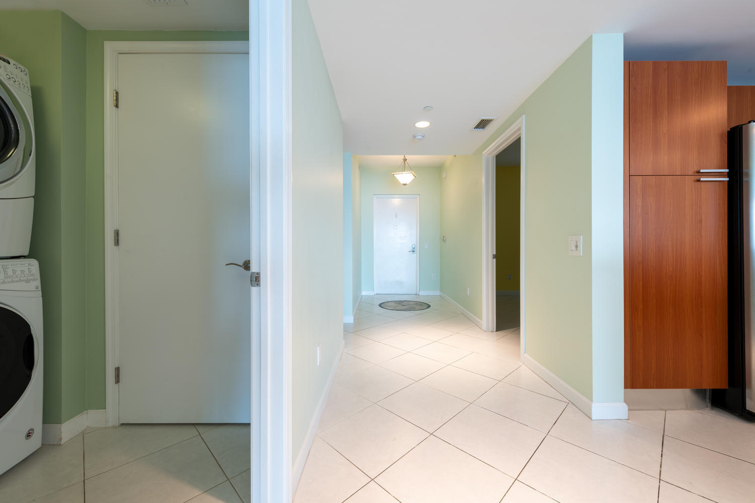 2640 Lake Shore Drive, Unit 1011 Riviera Beach, FL 33404 - Photo 21 of 60 a view of a hallway with closet and utility room