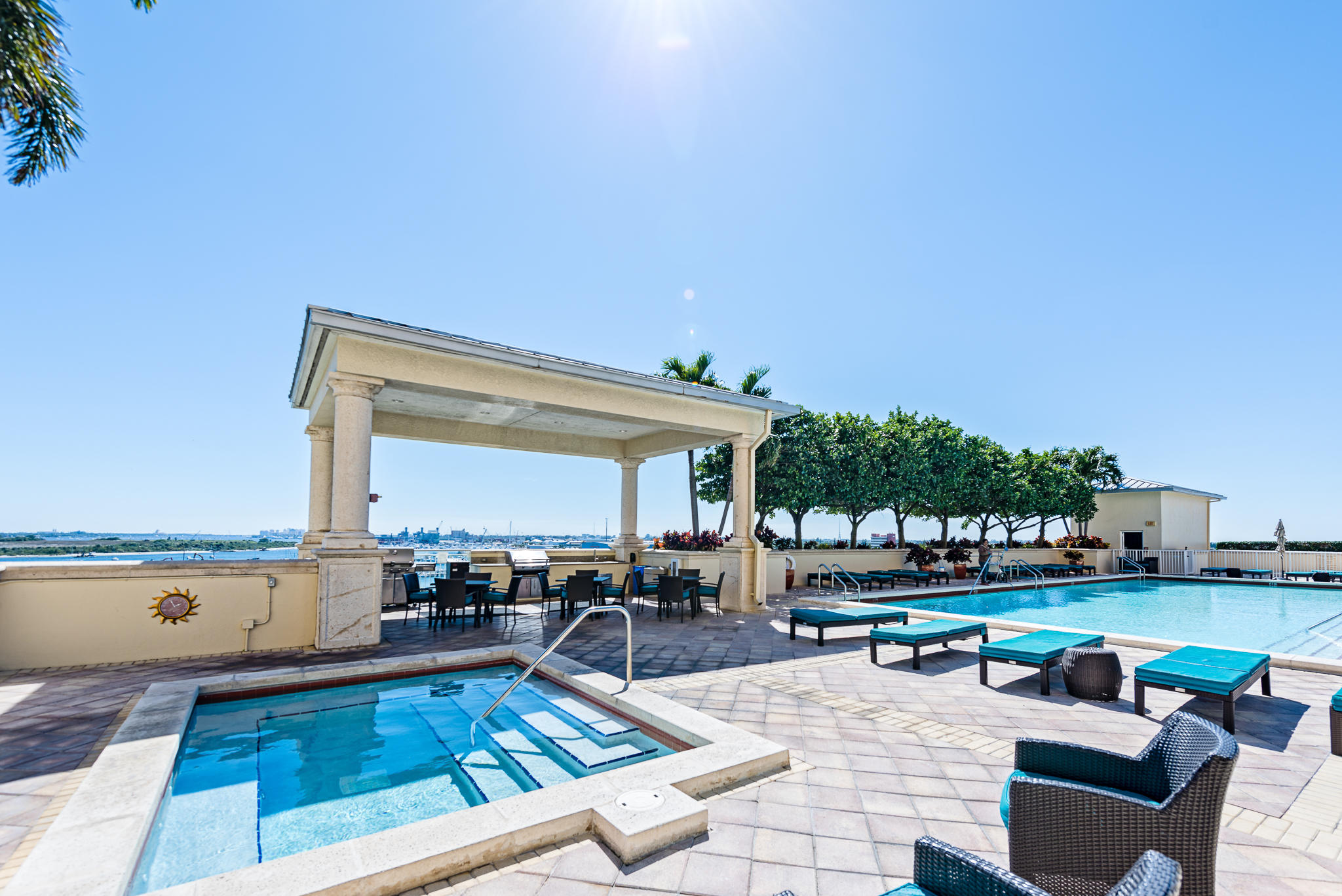 2640 Lake Shore Drive, Unit 1011 Riviera Beach, FL 33404 - Photo 35 of 60 a view of a swimming pool with chairs
