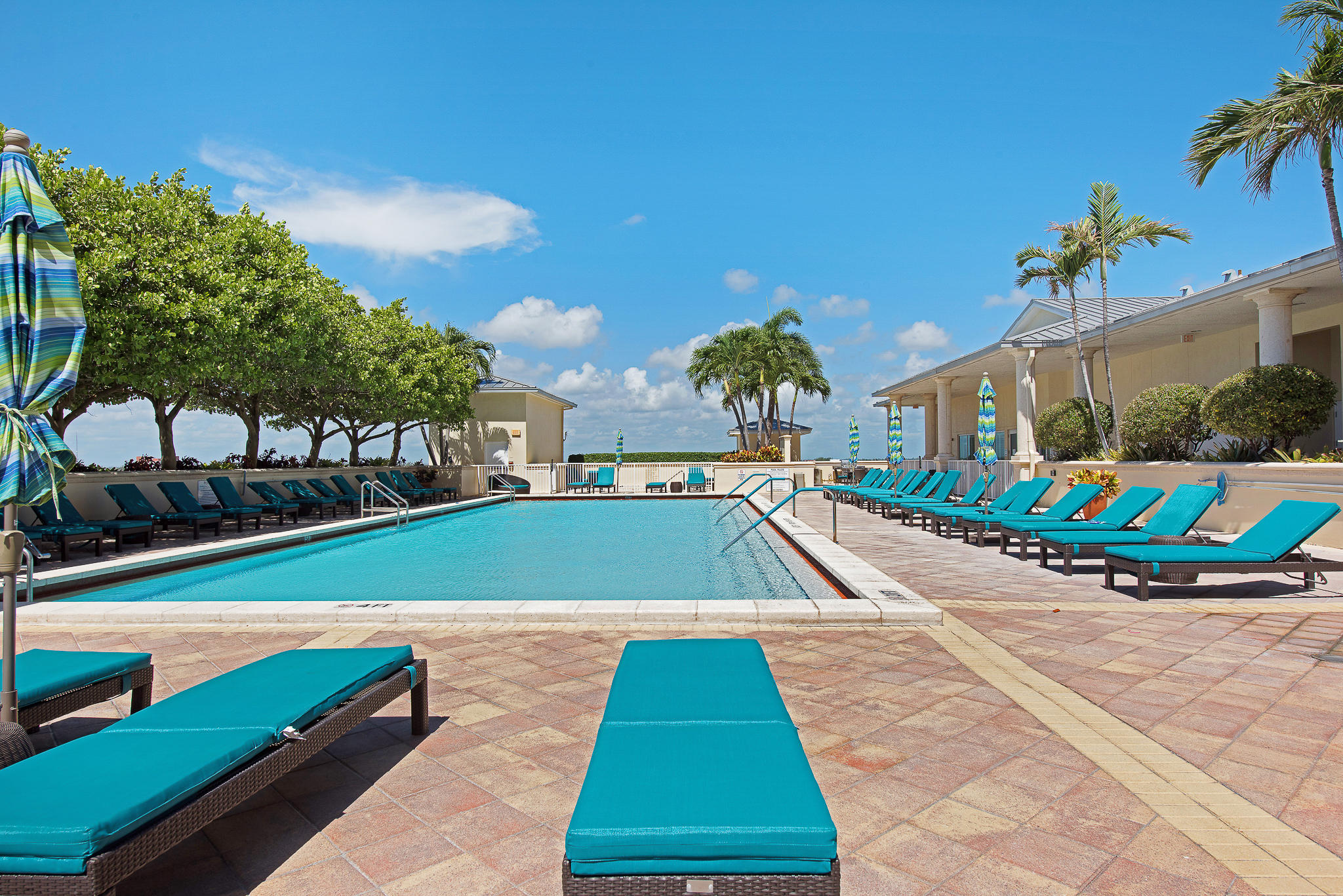 2640 Lake Shore Drive, Unit 1011 Riviera Beach, FL 33404 - Photo 37 of 60 a view of outdoor space pool patio and outdoor seating