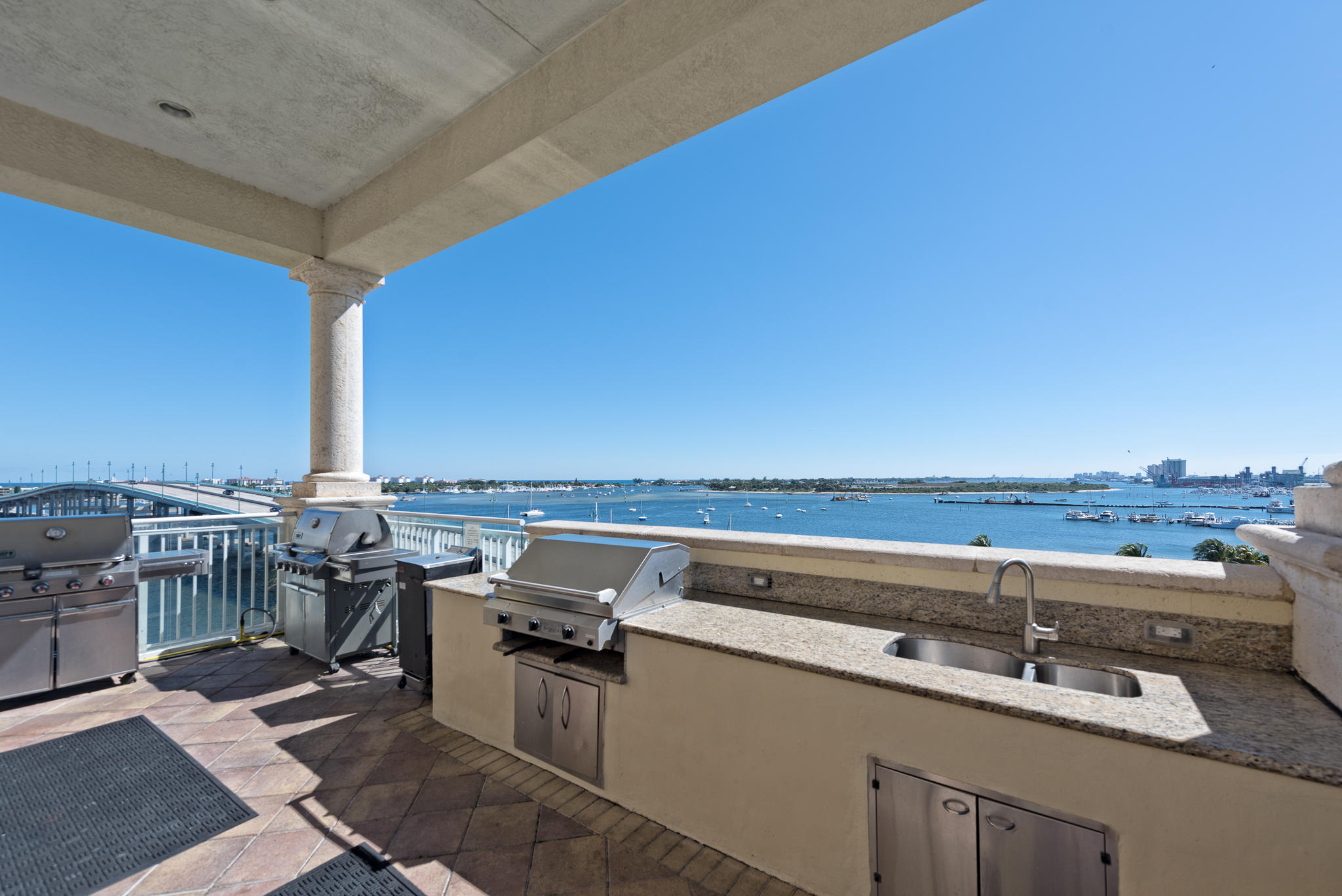 2640 Lake Shore Drive, Unit 1011 Riviera Beach, FL 33404 - Photo 39 of 60 a view of a balcony with chairs