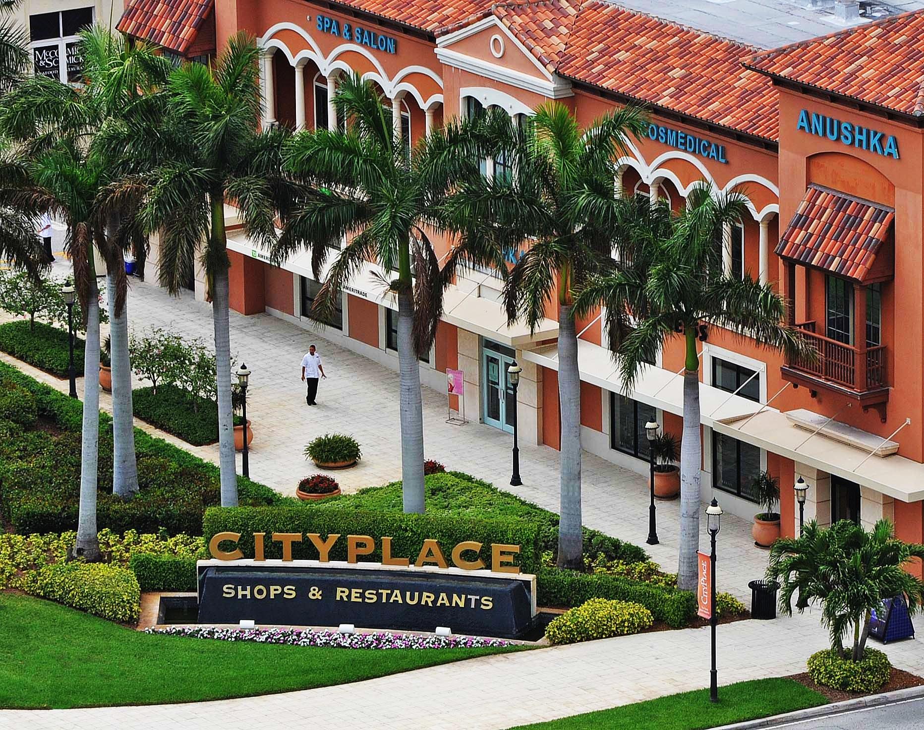 2640 Lake Shore Drive, Unit 1011 Riviera Beach, FL 33404 - Photo 48 of 60 a view of a building with a garden