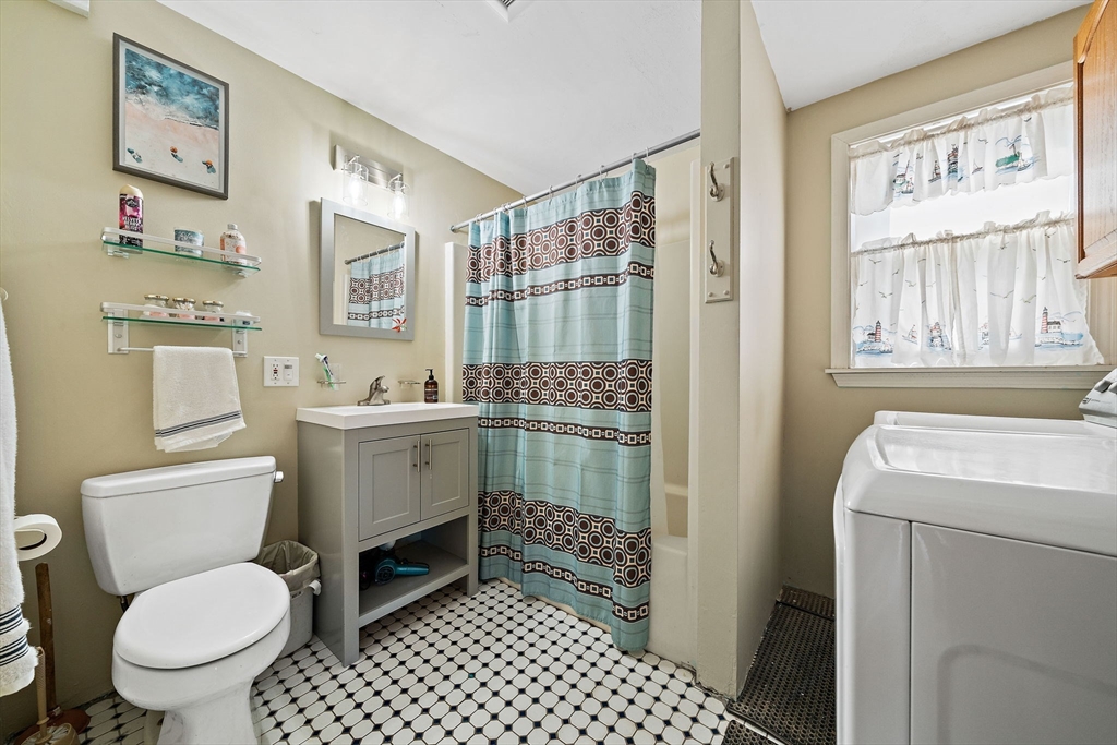 91 Shellton Road Quincy, MA 02169 - Photo 15 of 31 a bathroom with a granite countertop toilet sink and mirror