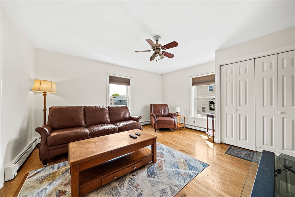 91 Shellton Road Quincy, MA 02169 - Photo 16 of 31 a living room with furniture a couch and wooden floor