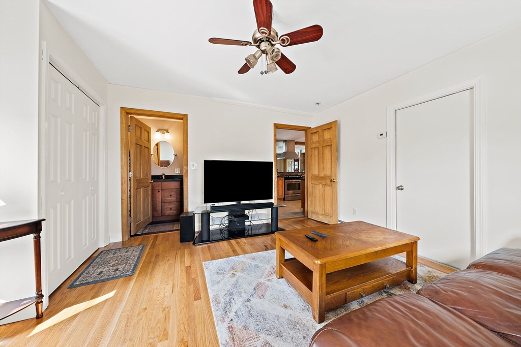 91 Shellton Road Quincy, MA 02169 - Photo 17 of 31 a living room with a bed and a flat screen tv