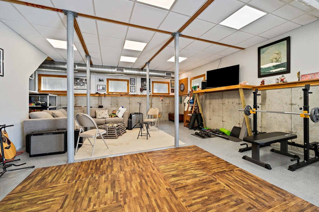 91 Shellton Road Quincy, MA 02169 - Photo 23 of 31 a living room with lots of furniture and a flat screen tv