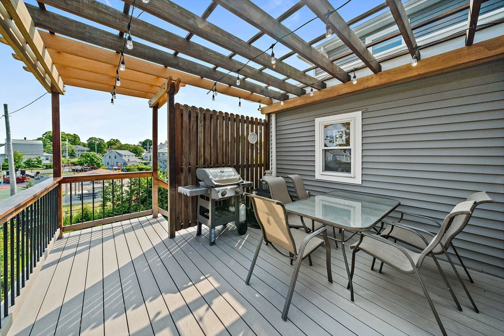 91 Shellton Road Quincy, MA 02169 - Photo 28 of 31 a view of a chairs and table on the deck