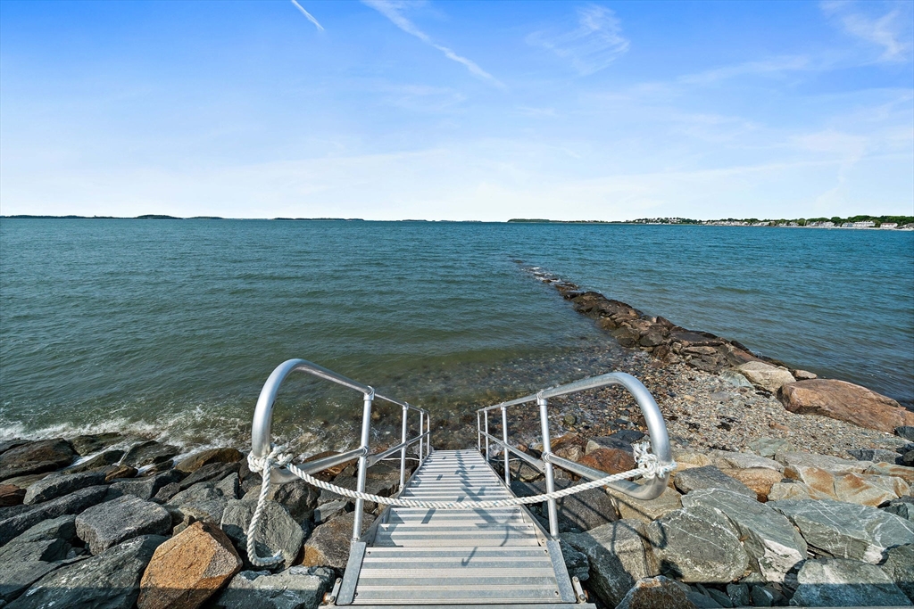 91 Shellton Road Quincy, MA 02169 - Photo 30 of 31 a view of a balcony with chair and wooden floor