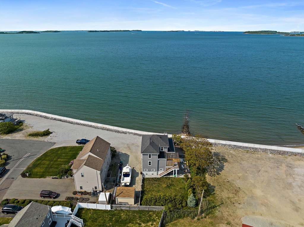 91 Shellton Road Quincy, MA 02169 - Photo 3 of 31 a view of a lake with houses