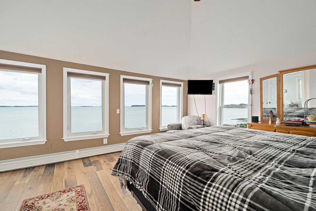 91 Shellton Road Quincy, MA 02169 - Photo 6 of 31 a bedroom with a large bed and a large window