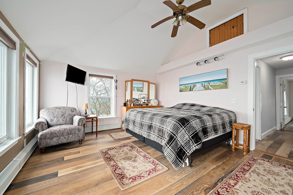 91 Shellton Road Quincy, MA 02169 - Photo 7 of 31 a bedroom with a bed a couch and a window