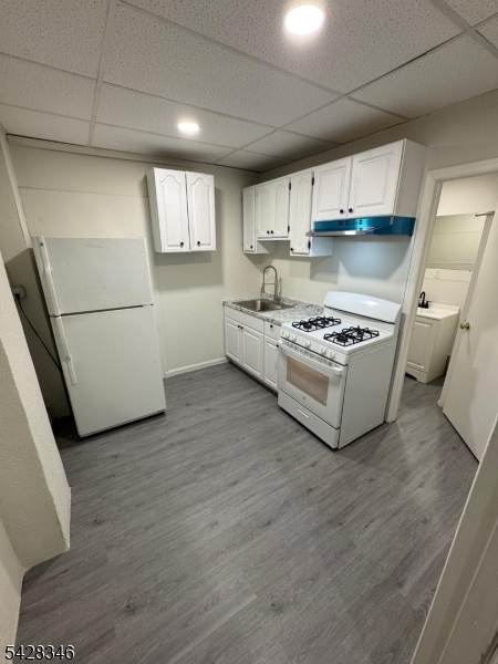 762 Main Street Paterson, NJ 07503 - Photo 1 of 5 a kitchen with stainless steel appliances a stove a sink and a refrigerator