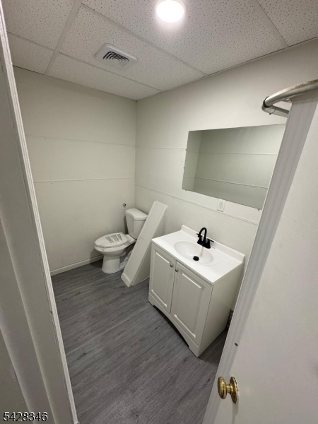 762 Main Street Paterson, NJ 07503 - Photo 2 of 5 a bathroom with a sink mirror and toilet
