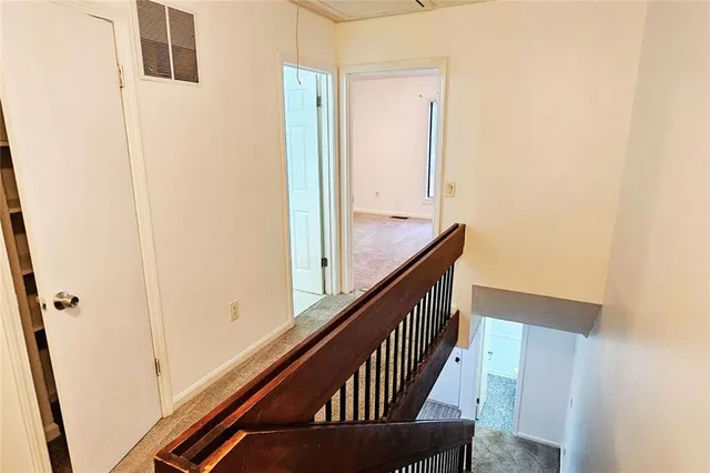 a view of balcony with wooden floor