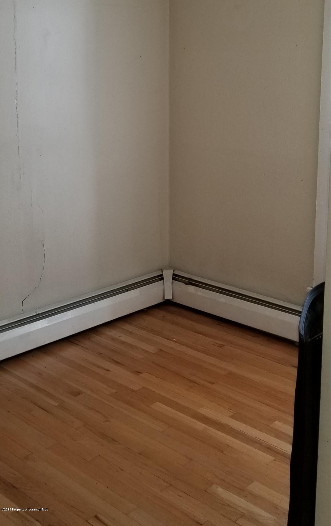 1443 Marcy Road Springville, PA 18844 - Photo 11 of 13 a view of an empty room with wooden floor