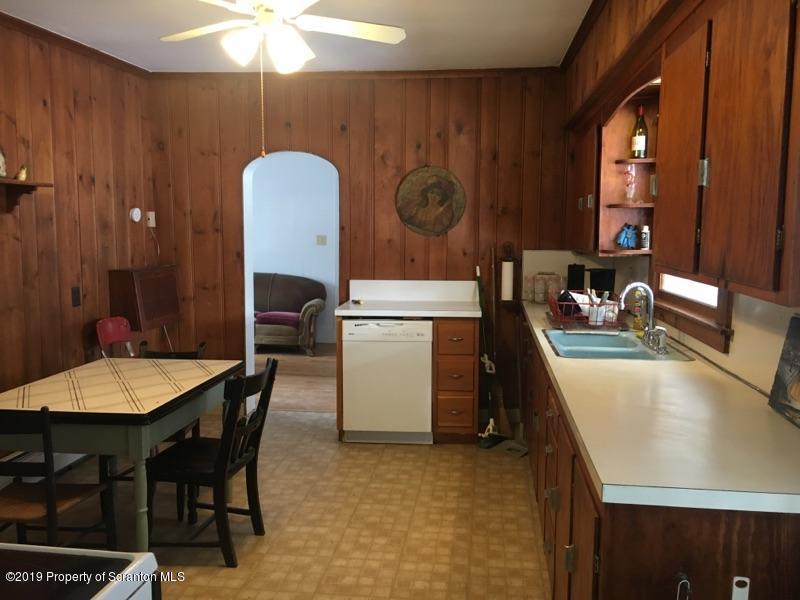 1443 Marcy Road Springville, PA 18844 - Photo 4 of 13 a dining room with a table chairs and a kitchen view