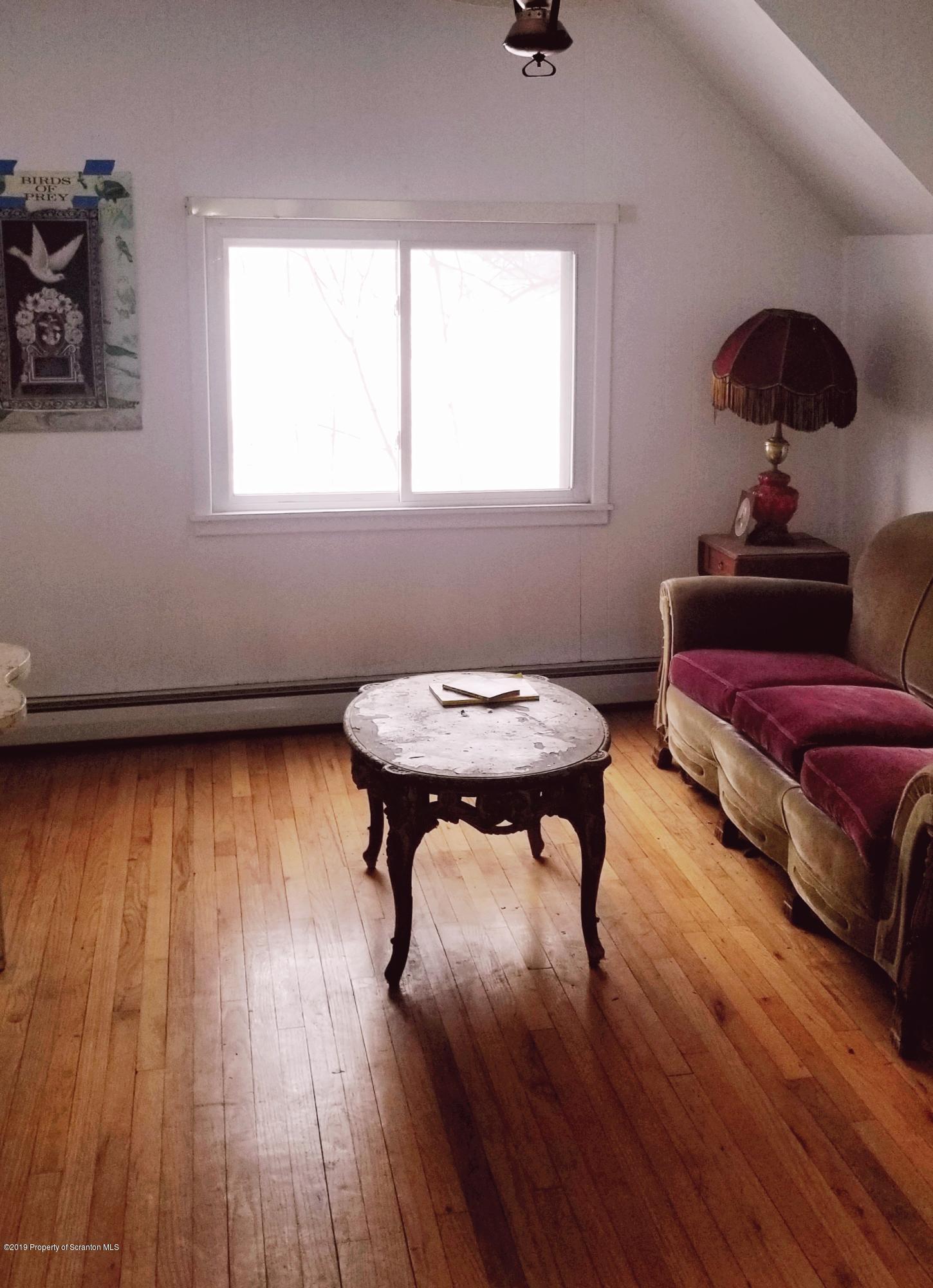 1443 Marcy Road Springville, PA 18844 - Photo 6 of 13 a room with furniture and wooden floor