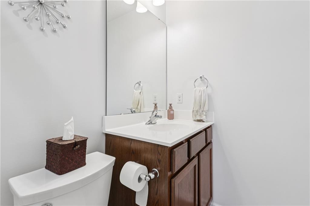 19 Truman Circle McKees Rocks, PA 15136 - Photo 33 of 45 a bathroom with a sink a toilet and a mirror