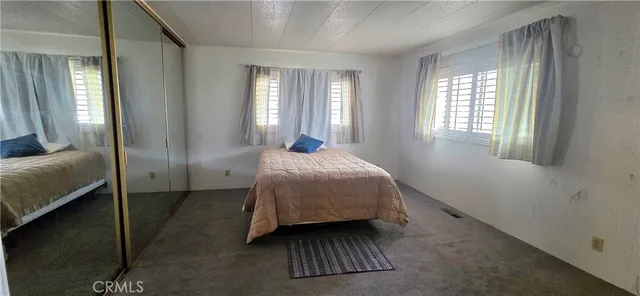 a bathroom with a mirror sink and vanity