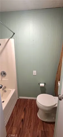 a view of a house with swimming pool and sitting area