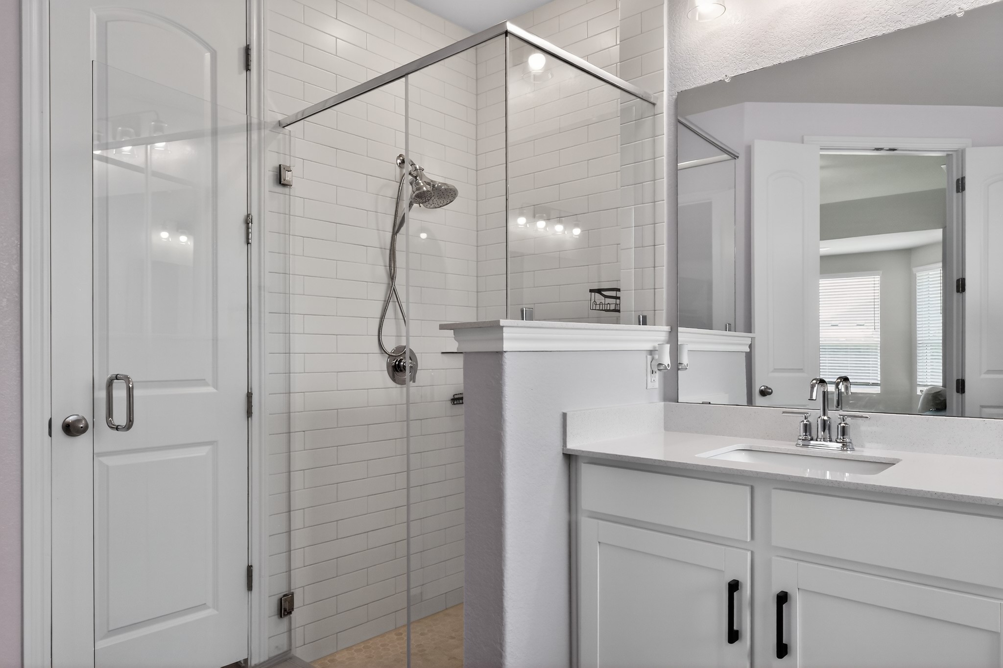 114 Bosco Road Hutto, TX 78634 - Photo 21 of 39 A well-lit bathroom features a spacious glass-enclosed shower alongside a pristine vanity with ample counter space.
