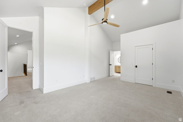 3027 Homestead Road Park City, UT 84098 - Photo 39 of 62 Spacious room featuring vaulted ceilings with an exposed wood beam, a contemporary ceiling fan, and recessed lighting