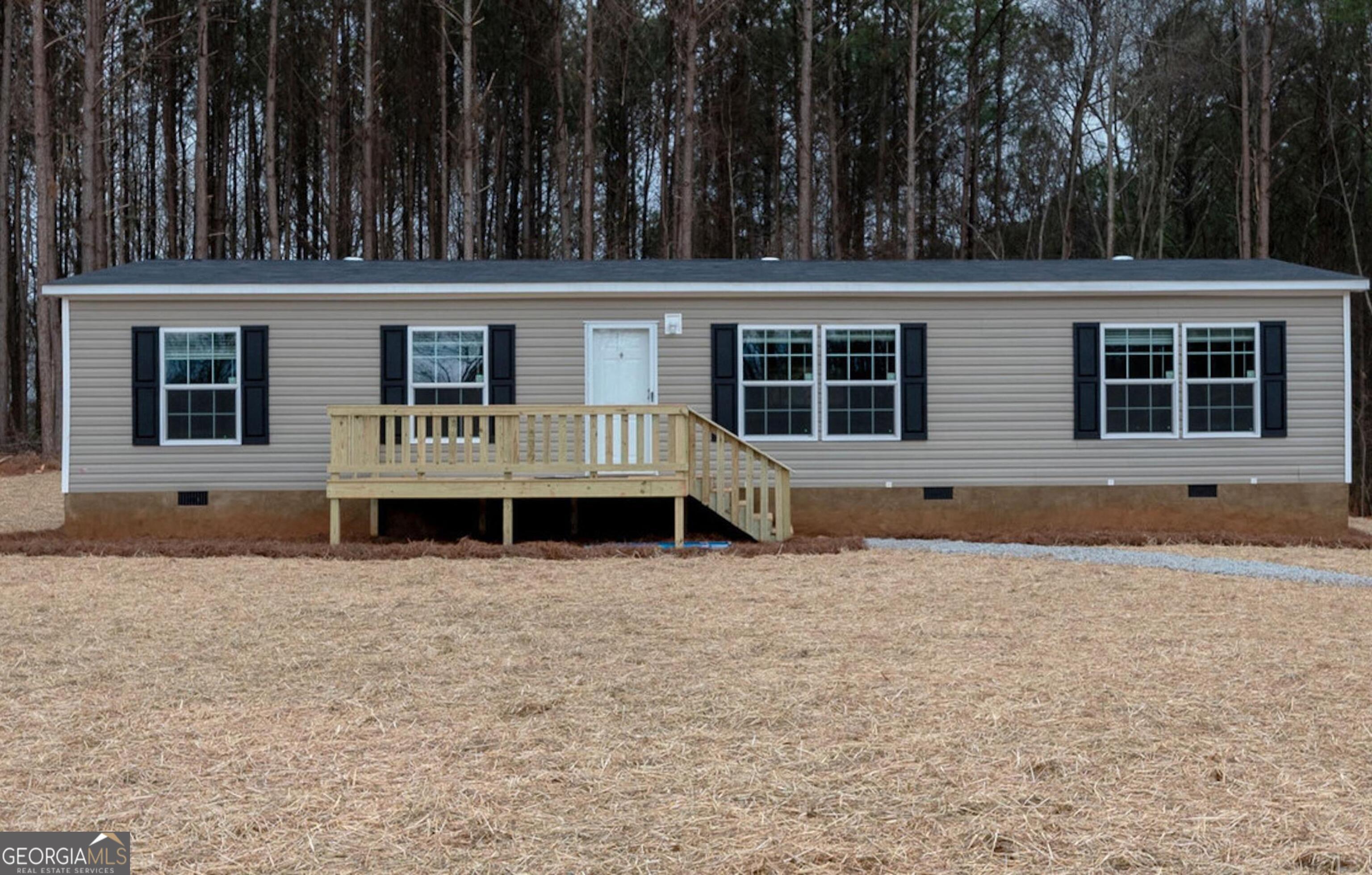 4022 Starrs Bridge Road Canon, GA 30520 - Photo 1 of 1 a house with trees in the background