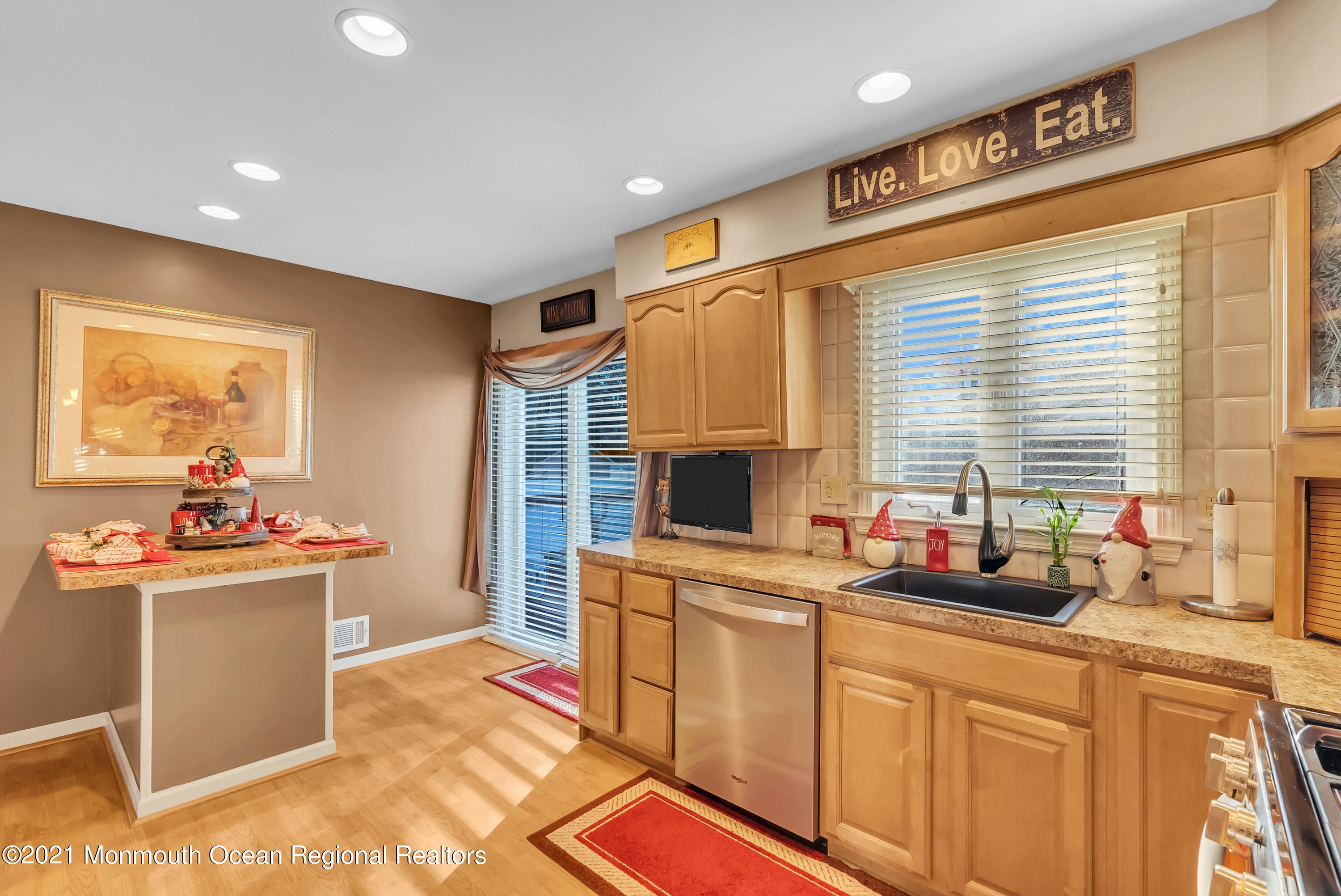 128 Whalepond Road Oakhurst, NJ 07755 - Photo 15 of 33 a kitchen with a sink stove and cabinets