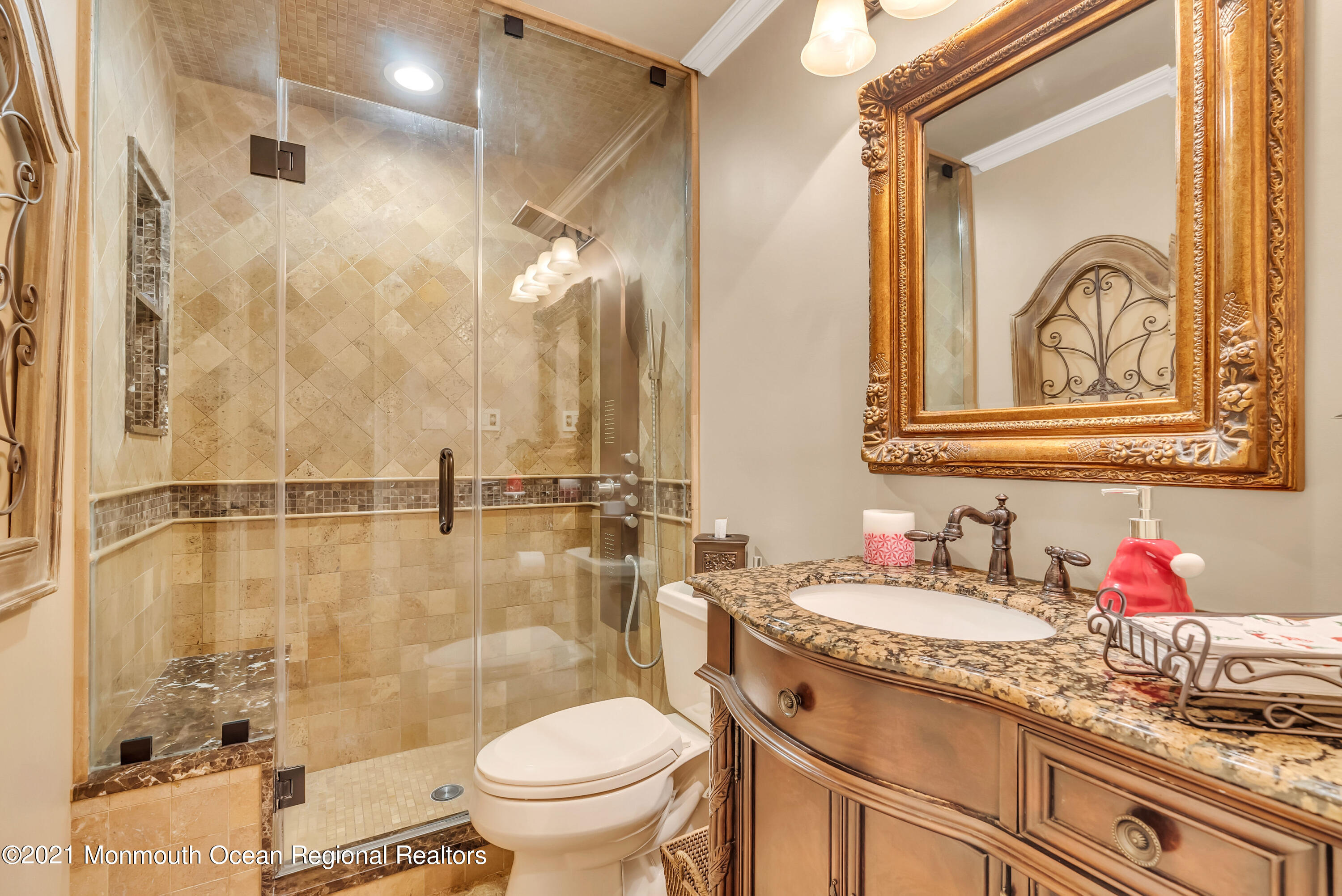 128 Whalepond Road Oakhurst, NJ 07755 - Photo 17 of 33 a bathroom with a granite countertop sink mirror vanity and toilet