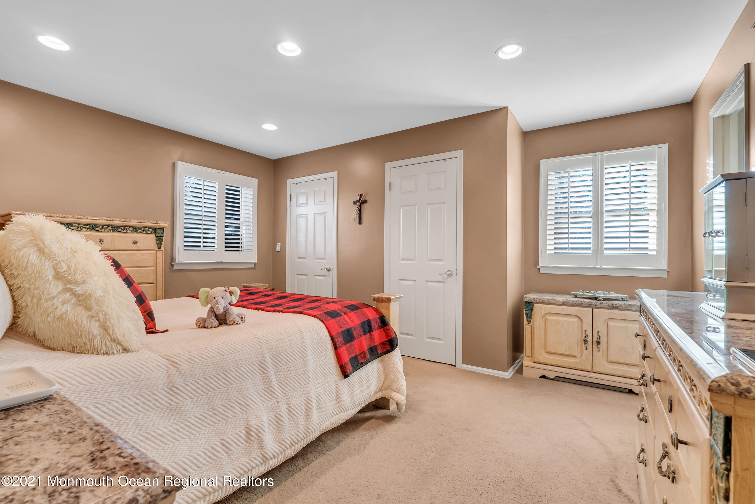 128 Whalepond Road Oakhurst, NJ 07755 - Photo 19 of 33 a spacious bedroom with a bed and a window