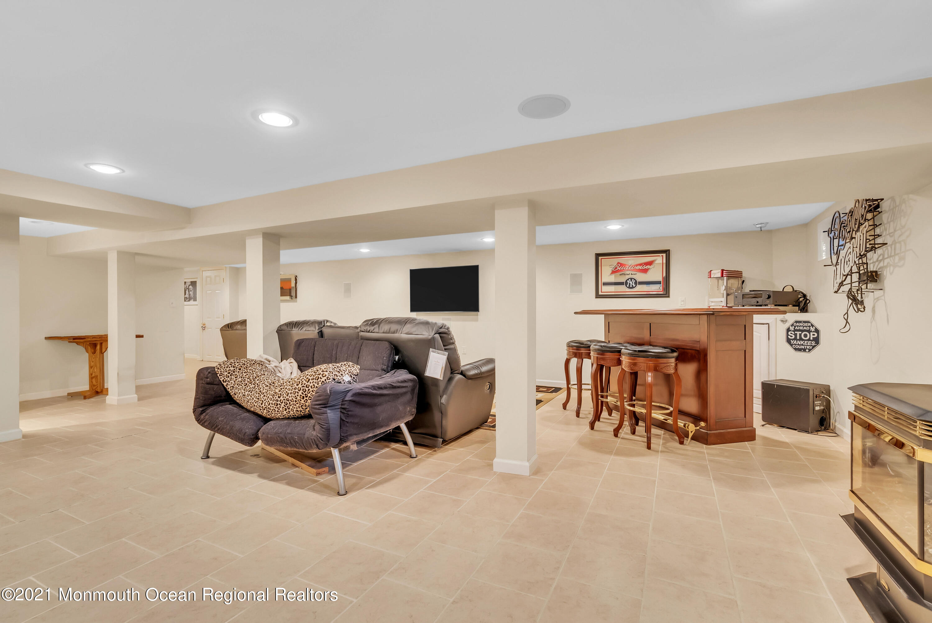 128 Whalepond Road Oakhurst, NJ 07755 - Photo 26 of 33 a living room with furniture and a flat screen tv